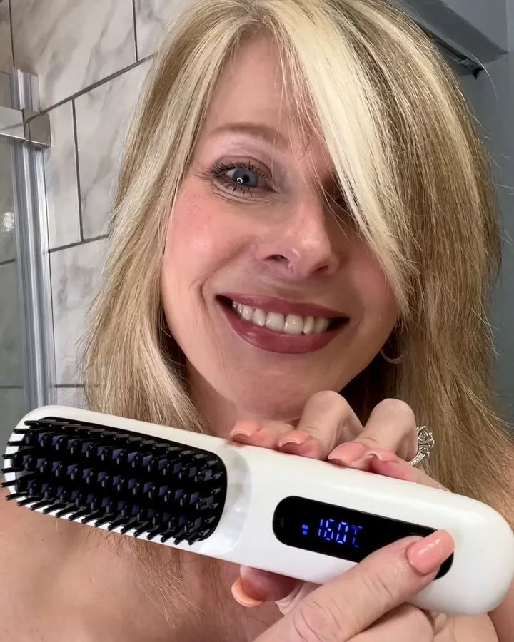Woman holding a white styling brush