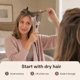 Woman placing Volara underneath a small section of dry hair