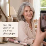 Woman with softly lifted fine hair smiling for a photograph